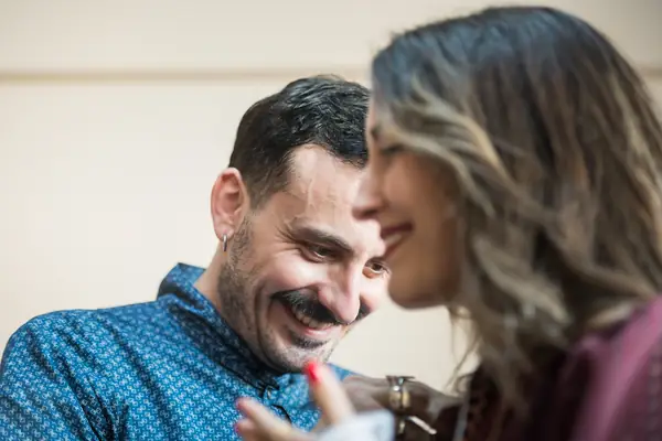 Panos laughing with a dancer backstage