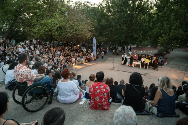 The audience sits round the circle before the dancing begins